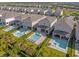 Aerial view of community, showcasing homes and pools at 365 Southfield St, Kissimmee, FL 34747