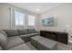 Game room with sectional sofa and large TV at 365 Southfield St, Kissimmee, FL 34747