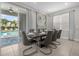 Elegant dining room with a large table and access to the pool area at 365 Southfield St, Kissimmee, FL 34747
