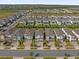 Aerial view of a residential community with numerous houses and pools at 365 Southfield St, Kissimmee, FL 34747