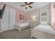 Charming bedroom with twin beds and playful decor at 365 Southfield St, Kissimmee, FL 34747