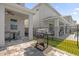 Outdoor patio with a grill and seating area adjacent to the pool at 365 Southfield St, Kissimmee, FL 34747