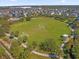 Aerial view of a community soccer field with goals and walking paths at 365 Southfield St, Kissimmee, FL 34747