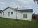 Home exterior with backyard, basketball hoop, and patio at 4612 Cheyenne Point Trl, Kissimmee, FL 34746