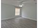Spacious bedroom with ceiling fan and wood-look floors at 4612 Cheyenne Point Trl, Kissimmee, FL 34746