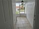 Bright screened porch with tile flooring and view of backyard at 4612 Cheyenne Point Trl, Kissimmee, FL 34746