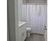 Updated bathroom with shower/tub combo and white vanity at 4612 Cheyenne Point Trl, Kissimmee, FL 34746