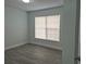 Bright bedroom with wood-look floors and window blinds at 4612 Cheyenne Point Trl, Kissimmee, FL 34746