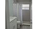 Updated bathroom with walk-in shower and white vanity at 4612 Cheyenne Point Trl, Kissimmee, FL 34746