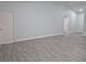 Bright living room with gray wood-look floors and a high ceiling at 4612 Cheyenne Point Trl, Kissimmee, FL 34746