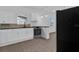 Updated kitchen with white shaker cabinets and granite countertops at 1020 W Line St, Leesburg, FL 34748