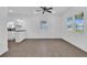 Open living room with hardwood floors and kitchen view at 1020 W Line St, Leesburg, FL 34748
