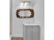 Updated bathroom features a vanity with modern cabinets and a decorative mirror at 1020 W Line St, Leesburg, FL 34748