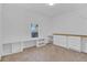 Bedroom with built-in shelving and carpeted floors at 1020 W Line St, Leesburg, FL 34748