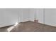 Bright bedroom with wood-look floors and ample closet space at 1020 W Line St, Leesburg, FL 34748
