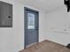Finished basement area with grey door and vinyl flooring at 1020 W Line St, Leesburg, FL 34748