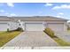 Two-car garage with paver driveway at 11209 Listening Dr, Orlando, FL 32832
