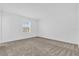 Spacious bedroom with neutral carpeting and a large window at 11209 Listening Dr, Orlando, FL 32832