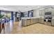 Open concept kitchen with stainless steel appliances and an island at 1430 Thunderbird Rd, Davenport, FL 33896