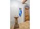 Medieval-themed entryway with a suit of armor and wooden door at 1430 Thunderbird Rd, Davenport, FL 33896