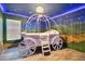 Charming bedroom with a carriage bed and a starry night mural at 1430 Thunderbird Rd, Davenport, FL 33896