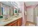 Pink bathroom with double vanity and shower at 1430 Thunderbird Rd, Davenport, FL 33896