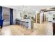 Modern kitchen with stainless steel appliances and breakfast bar at 1430 Thunderbird Rd, Davenport, FL 33896
