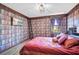 Bedroom with a bookcase-themed wall and a large bed at 1430 Thunderbird Rd, Davenport, FL 33896