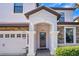 House entrance with a stone facade and a decorative door at 1430 Thunderbird Rd, Davenport, FL 33896