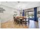 Bright dining room with a large round table and seating for eight at 1430 Thunderbird Rd, Davenport, FL 33896