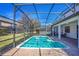 Screened-in pool with patio furniture at 1430 Thunderbird Rd, Davenport, FL 33896