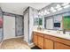 Bathroom with double vanity and gray walls at 1430 Thunderbird Rd, Davenport, FL 33896