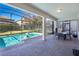 Screened-in pool area with patio furniture at 1430 Thunderbird Rd, Davenport, FL 33896