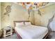 Bedroom with a rustic design and hanging baskets above the bed at 1430 Thunderbird Rd, Davenport, FL 33896