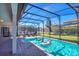 Relaxing screened pool with lounge chairs and inflatable toys at 1430 Thunderbird Rd, Davenport, FL 33896