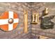 Medieval-themed game room with shield, sword, and armor at 1430 Thunderbird Rd, Davenport, FL 33896