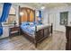 Bedroom with a large bed and unique stone wall features at 1430 Thunderbird Rd, Davenport, FL 33896