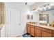 Double vanity bathroom with a walk-in shower at 1430 Thunderbird Rd, Davenport, FL 33896