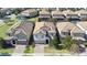 Aerial view of three-story house in a residential community at 1430 Thunderbird Rd, Davenport, FL 33896