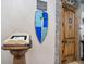 Medieval-themed entryway with a suit of armor and wooden door at 1430 Thunderbird Rd, Davenport, FL 33896