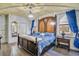 Elegant bedroom with a large bed and castle theme decor at 1430 Thunderbird Rd, Davenport, FL 33896