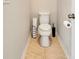 Small powder room with toilet and tile flooring at 2781 Sand Oak Loop, Apopka, FL 32712