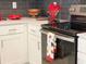 Modern kitchen with white cabinets and stove at 3161 Paradox Cir # 301, Kissimmee, FL 34746