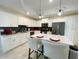 Modern kitchen with white cabinets and a large island at 3161 Paradox Cir # 301, Kissimmee, FL 34746