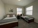 Bedroom with two twin beds, nightstand, and window coverings at 3161 Paradox Cir # 301, Kissimmee, FL 34746