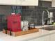 Kitchen counter with coffee maker and supplies at 3161 Paradox Cir # 301, Kissimmee, FL 34746