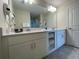 Double vanity bathroom with a large mirror and plenty of cabinet space at 3161 Paradox Cir # 301, Kissimmee, FL 34746