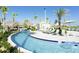 Resort-style lazy river with lounge chairs at 3161 Paradox Cir # 301, Kissimmee, FL 34746