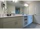 Double vanity bathroom with a large mirror and plenty of cabinet space at 3161 Paradox Cir # 301, Kissimmee, FL 34746