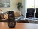 Wicker lantern on a light wood table at 3161 Paradox Cir # 301, Kissimmee, FL 34746